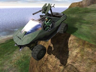 Promotional image for an early build of Halo: Combat Evolved featuring John-117 driving his M12 Chaingun Warthog off a cliff. Screenshot of the level The Silent Cartographer from the Halo: Combat Evolved press kit on the The Ultimate Halo Companion DVD Set.