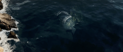A Forerunner construct looks at the underwater wreckage of a Warthog from the Halo Infinite announcement trailer.