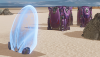 A Halo: Reach-derived stationary shield generator near three Covenant supply cases in The Halo Experience Showcase.