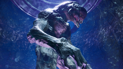 A Hesduros Sangheili held inside a gene-forge aboard the Triumph of Tolerance during Operation: METEORITE. Screenshot taken from Halo: Campaign Evolved campaign level Boarding Action.