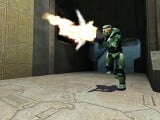 The Master Chief firing an assault rifle.