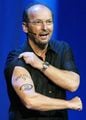 Peter Moore showing off his tattoo.