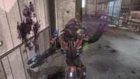 A Sangheili Zealot being dealt the final blow from SPARTAN-B312, causing it's blood to splatter on the wall.