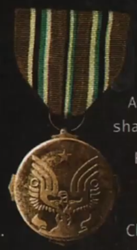 A crop of the medal from a Believe Print ad.