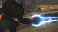 An Elite activates his energy sword.