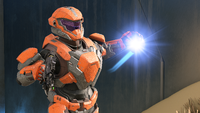 A Seeker-clad Spartan prepares to throw a plasma grenade.