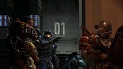 NOBLE Team's Carter-A259 speaking to Emile-A239 and Jorge-052 while Catherine-B320 works on some tech in Visegrád Relay, as seen in Halo: Reach campaign level Winter Contingency.