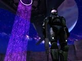 The Master chief next to the gravity lift of the Truth and Reconciliation in a promotional screenshot of Halo: Combat Evolved.