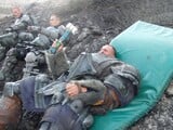 On set photo of two ODST and the Brute lying down.