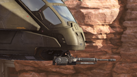 A profile view of the Pelican's M370 autocannon in Halo Infinite.