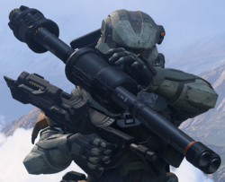 Third-person view of a SPARTAN-IV reloading an M41 SPNKR in Halo Infinite multiplayer.