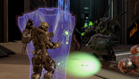 A hardlight shield deflecting fire from a Mgalekgolo's assault cannon.