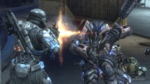 A Chieftain charging a SPARTAN III in the Firefight game mode in Halo: Reach.