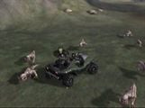 A pack of blind wolves run past a Warthog in an early build of Halo: Combat Evolved.