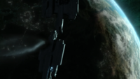 The wreck of a UNSC frigate attached to the fleet floating in orbit above Reach.