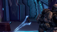 A cloaked Stealth Sangheili with an energy sword sneaking up on marines.