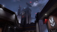 A command tower above the facility, with the planet's shattered moon in the background.