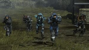 Members of NOBLE Team (Carter-A259, Catherine-B320, Emile-A239, Jorge-052 and SPARTAN-B312) moving across a field in Visegrád, as seen in Halo: Reach campaign level Winter Contingency.