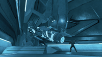 A member of Fireteam Crimson standing before the Forerunner power source inside the structure.