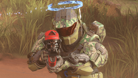 A Spartan-IV wearing the Menachite helmet with the Calling Card attachment on Oasis.