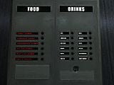 The vending machines in the Cafeteria aboard the Autumn. Note that water is listed twice in "Drinks".