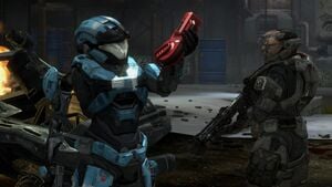 Catherine-B320 of NOBLE Team inspecting a distress beacon while Emile-A239 stands guard, as seen in Halo: Reach campaign level Winter Contingency.