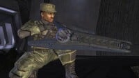 Sergeant Major Johnson with a particle beam rifle in the control room.