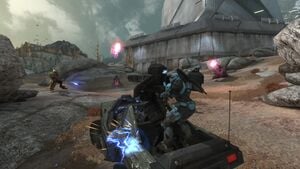 Noble Strike (Catherine-B320 and SPARTAN-B312) and a UNSC Army trooper on an M12G1 Gauss Warthog fighting Covenant Rizvum-pattern Revenants near SWORD Base's gate, as seen in Halo: Reach campaign level ONI: Sword Base.