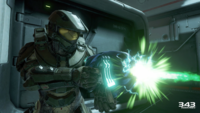 John-117 overcharging a plasma pistol during the Raid on Argent Moon in a Halo 5: Guardians prerelease screenshot.