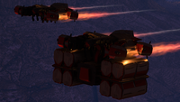 Two siege-haulers, one carrying crates, on Suban.