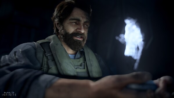 The Pilot watching a holographic message.