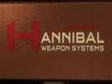 A logo of Hannibal Weapon Systems on a wall.