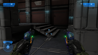 First-person view of dual-wielding plasma pistols in Halo 2: Anniversary campaign.
