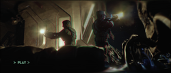 Jacob Keyes and Avery Johnson surrounded by Flood pod infectors in the Installation 04 Flood containment facility, as seen in Wallace Jenkins' helmet recording. Screenshot taken from Halo: Campaign Evolved campaign level 343 Guilty Spark.