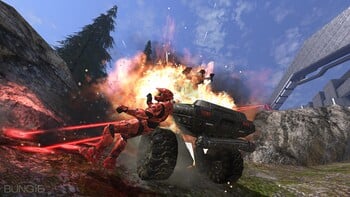 Promotional image for the Alpha build of Halo 3 featuring an M12 Chaingun Warthog being destroyed by an M6/R Spartan Laser on the multiplayer map Valhalla.