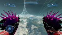 First-person view of a player carrying three Nahle'hax-pattern needlers in Halo 2: Anniversary Multiplayer.