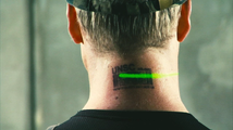 The bar code tattooed on the back of a UNSC Marine's neck is scanned in the Video.