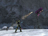 Promotional image for Halo: Combat Evolved featuring John-117 firing an M41B SPNKr at a Oghal-pattern Banshee. Screenshot of the level Assault on the Control Room from the Halo: Combat Evolved press kit.