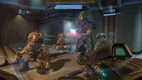An Unggoy Imperial and Sangheili Storm confront the Master Chief in a corridor on the Dawn.