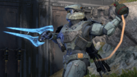 A Spartan throws a grenade while wielding a Meluth'qelos-pattern energy sword.