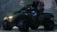 Spartans driving a Warthog during a game of Big Team Infection.
