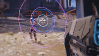 A debug view in Halo 5: Guardians, where aim assist is partially engaged. The smaller white cross shows where the shot will be directed.