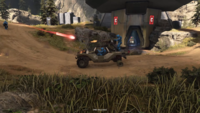 A Warthog missing a wheel in Halo Infinite.
