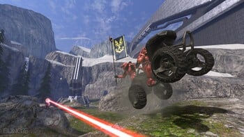 Promotional image for the Alpha build of Halo 3 featuring an M274 Mongoose carrying the flag carrier while narrowly missed by M6/R Spartan Laser fire on the multiplayer map Valhalla.