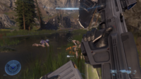 First-person view of an MA40 being reloaded in the Halo Infinite Campaign Gameplay Premiere, with a cartridge being visible in the magazine.