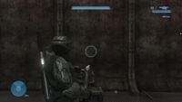 The HUD reticule of the M7057/Defoliant Projector as seen in the Halo 3 campaign level Floodgate. Note that the camera focuses outward in a third-person view, similar to the view when wielding a heavy turret.
