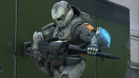 A Spartan reloading a Skewer's spike projectile in Halo Infinite.
