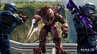 A Sangheili cornered by two Spartans at the exterior section.