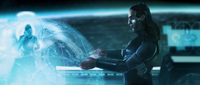 Forthencho, Lord of Admirals, examines a hologram of an infested Forerunner world.