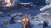 Third-person view of Edward Buck using a stationary Splinter turret in the Halo 5: Guardians campaign.